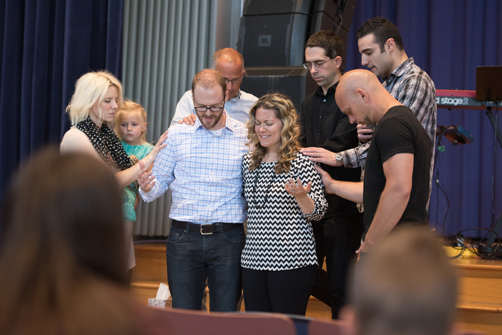Praying over Peter and Laura Andrews, and commissioning Laura into her new role.